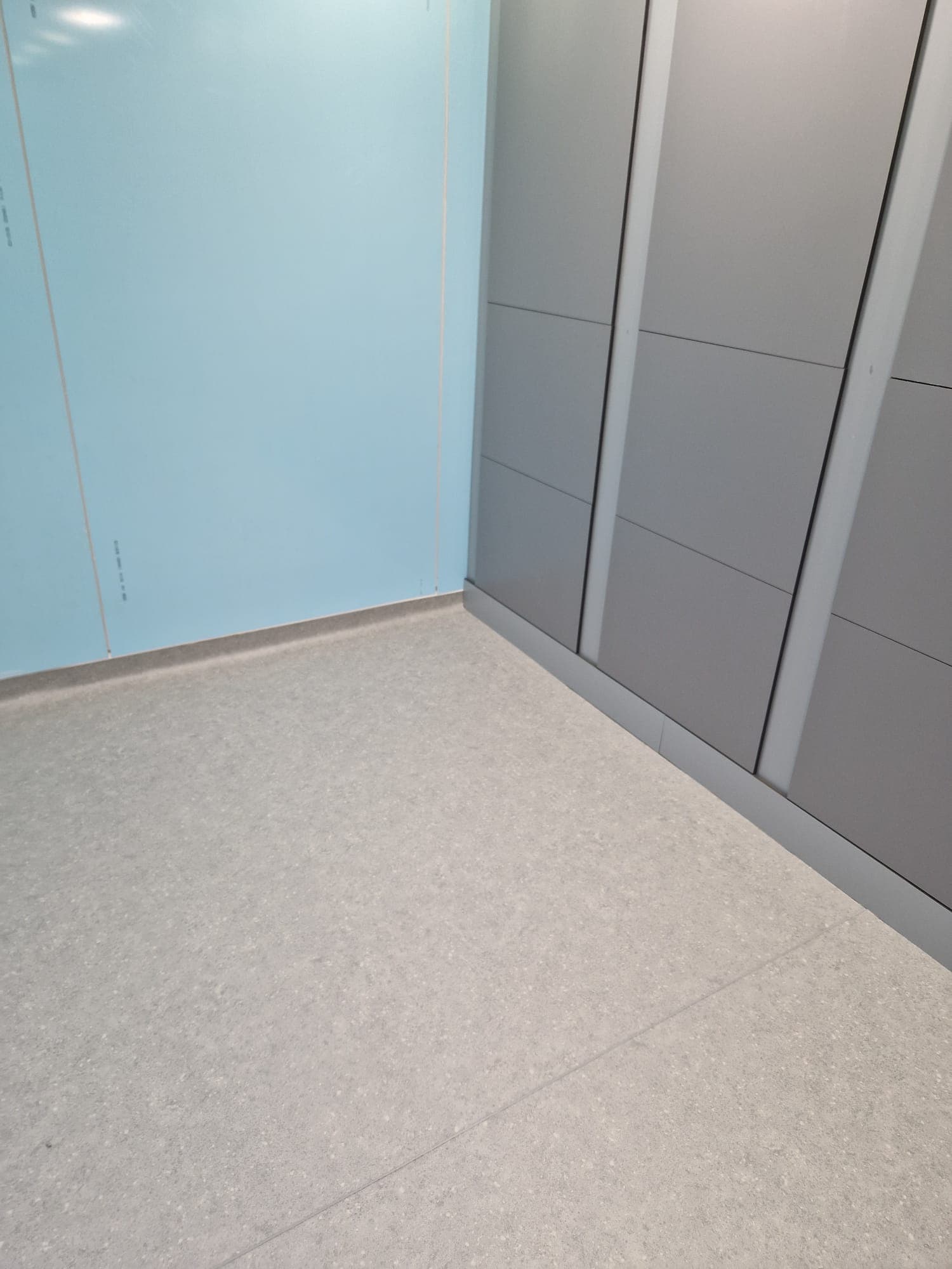 Herringbone luxury vinyl plank pattern aligned across a residential floor