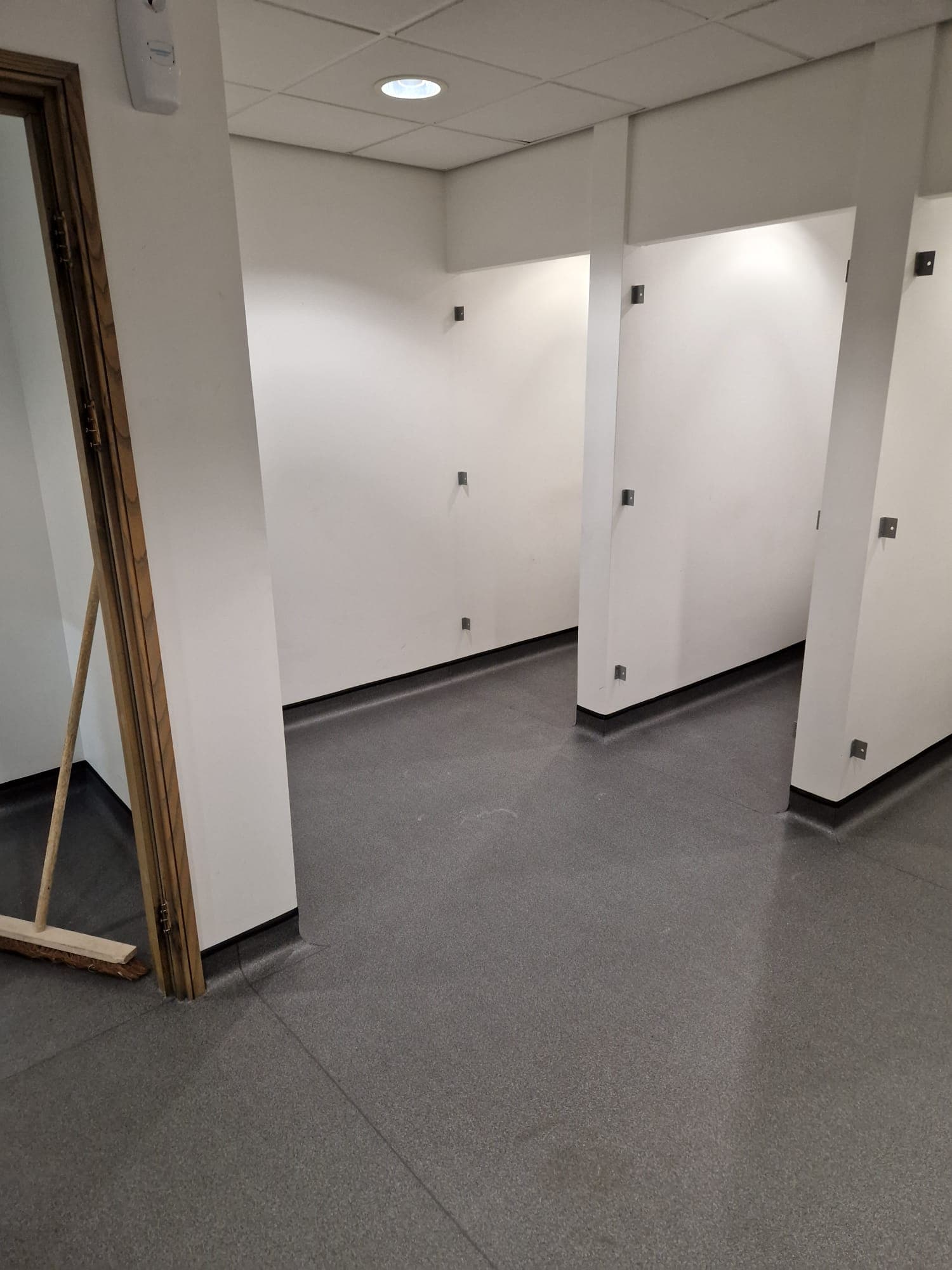 Commercial safety flooring installed in Northampton — hot-welded sheet vinyl with sealed perimeter